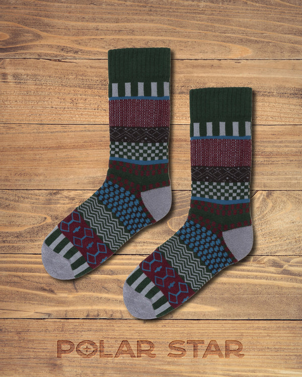 Iver nordic socks by Polar Star, flat pair photographed on wood