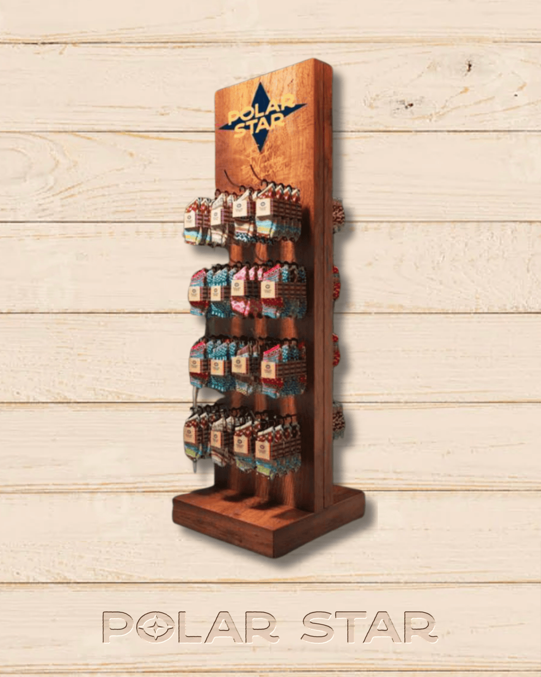 Polar Star large wooden retail display stand, hung with packs of nordic socks