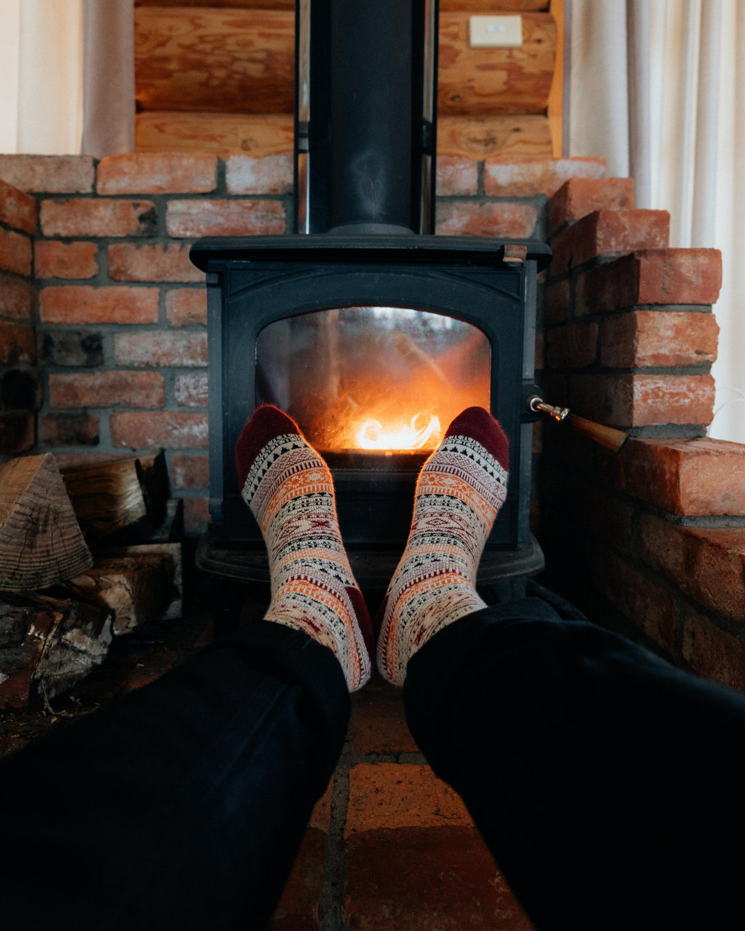 Ada nordic socks worn, overhead view of feet resting on a hiking map