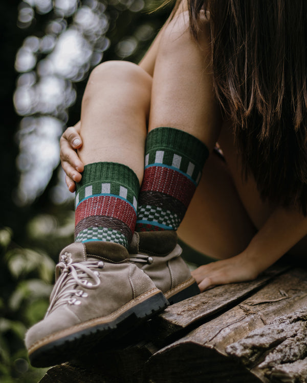 Iver nordic socks worn indoors, overhead view with cups of coffee and biscuits