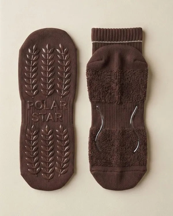 Outside: Grips the mat. Inside: Holds your foot.