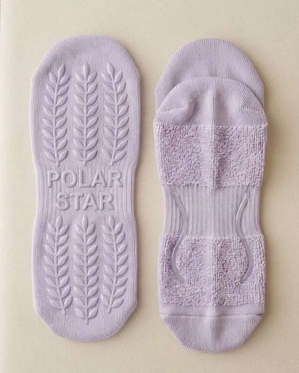 Outside: Grips the mat. Inside: Holds your foot.