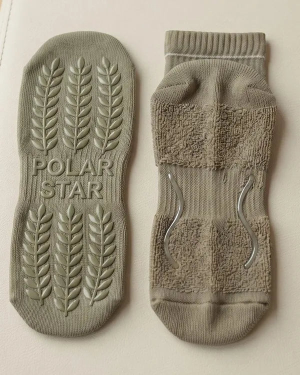 Outside: Grips the mat. Inside: Holds your foot.