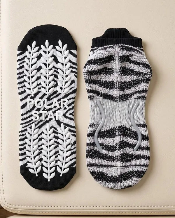 Outside: Grips the mat. Inside: Holds your foot.